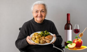 Elderly Holocaust survivor smiling while holding a plate of a warm holiday meal.